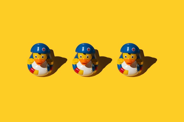 rubber ducks on yellow background