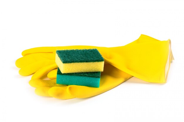 Rubber gloves and sponges isolated on white background