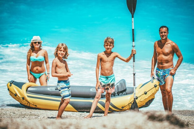 Rubber kayak is prepared for happy family sailing at the beach