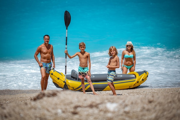 Rubber kayak is prepared for happy family sailing at the beach.