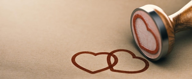 クラフト紙の背景にゴム印と2つのハートの形。愛とバレンタインデーの概念。 3Dイラスト。