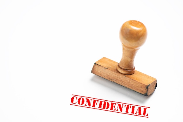 rubber stamp with confidential sign on white background. close up