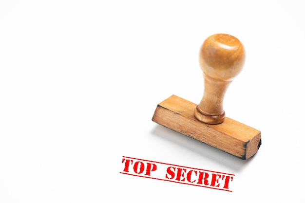 rubber stamp with top secret sign on white background. close up