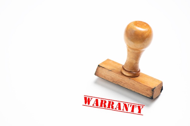 rubber stamp with warranty sign on white background. close up