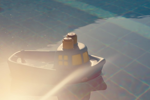 Rubber toy ship floats in the pool