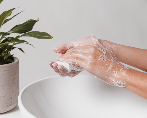 Photo rubbing soap in hands for a good clean