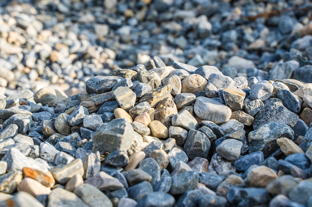 Rubble or gravel background, construction material. Pile of many small stones, stock photo