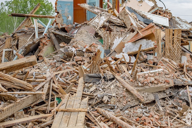 Rubble of old ruined house. Pile of construction fragments