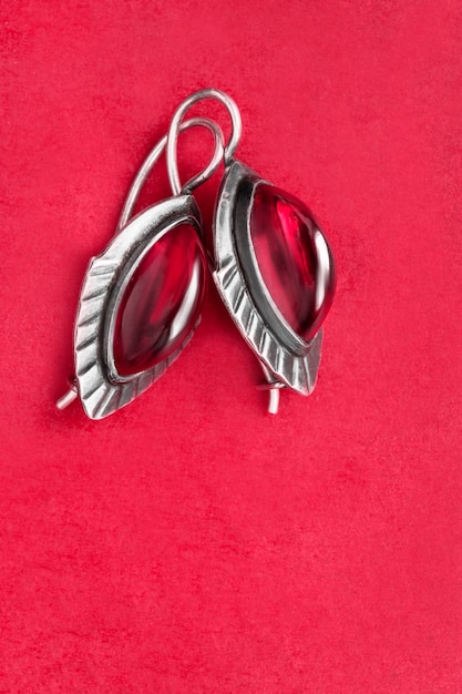 Ruby earrings on red