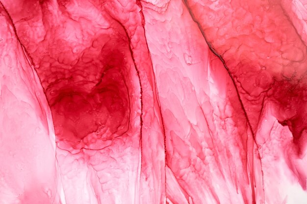 Ruby pink ink abstract background marble texture fluid art pattern wallpaper paint mix underwater wavy spots and stains