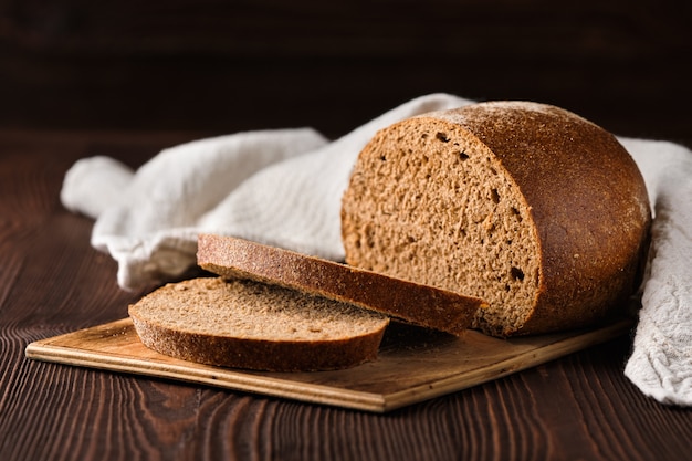 Rue brown bread on cutting board