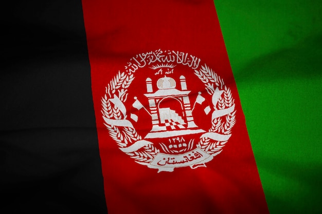 Photo ruffled flag of afghanistan blowing in wind