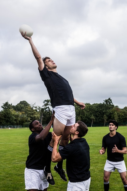 Rugby players jumping for line out