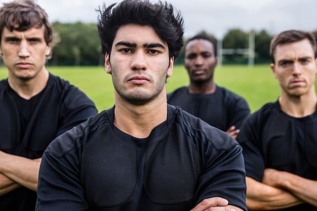 Rugby players scowling at camera