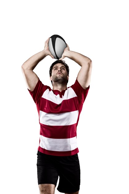 Rugbyspeler in een rood uniform.