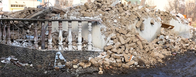 Ruined house. Demolition of a building. Demolition of an old dilapidated building before the construction of a new one on the same site. Old ruined abandoned building.