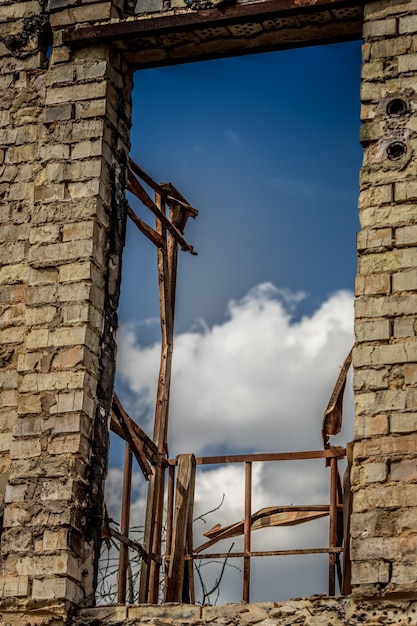 Ruined house. Ruins of a residential building. Brick walls. War in Ukraine.