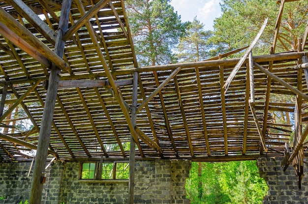 The ruined roof of a large barn.