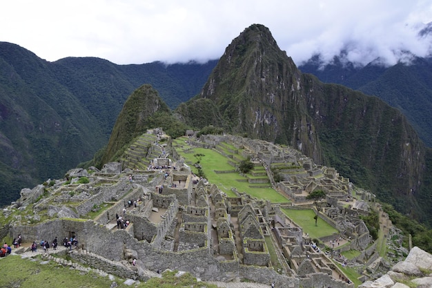 Ruins of the ancient Inca city machu picchu in fog Peru