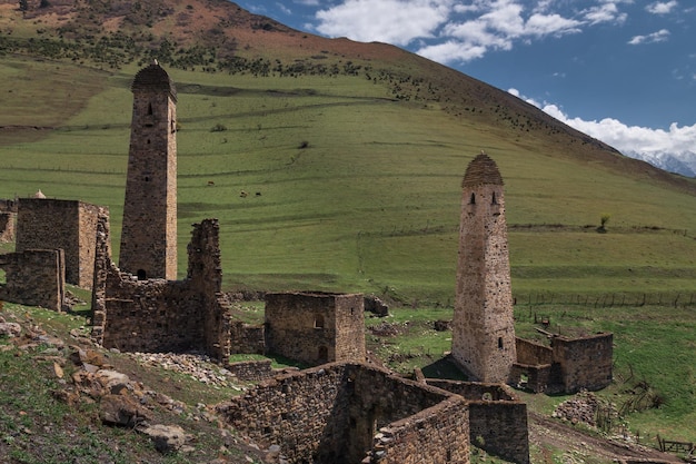 Ruins of an ancient Ingush mountain village with stone towers and houses Ingushetia Russia