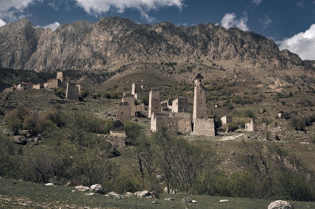 Ruins of an ancient Ingush mountain village with stone towers and houses Ingushetia Russia