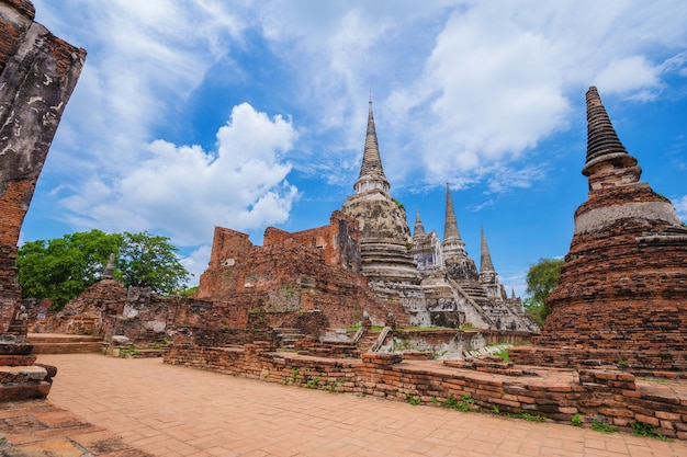 Ruins of buddha statues and pagoda of Wat Phra Si Sanphet in Ayutthaya historical park, Thailand