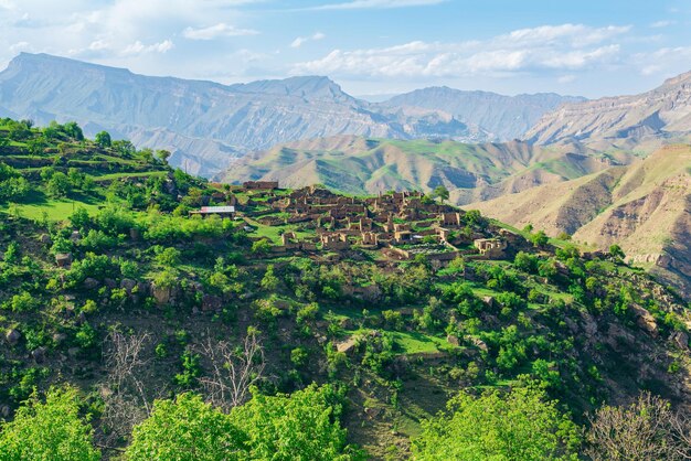 Ruins of houses on a mountainside in Kurib a depopulated village with the only remaining household with an apiary Dagestan