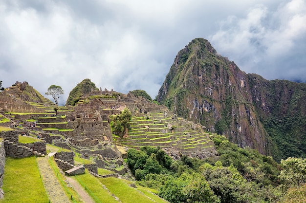 Ruins of Machu Picchu and mount in clouds. Sacred Valley of inca. Peru. South America