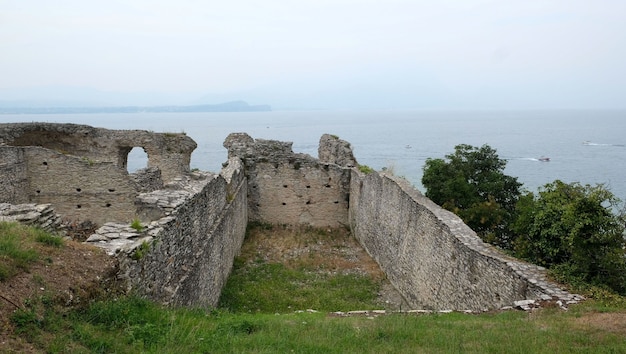 Ruins of roman villa grottoes of catullus in sirmione at lake garda in itlay in the summer