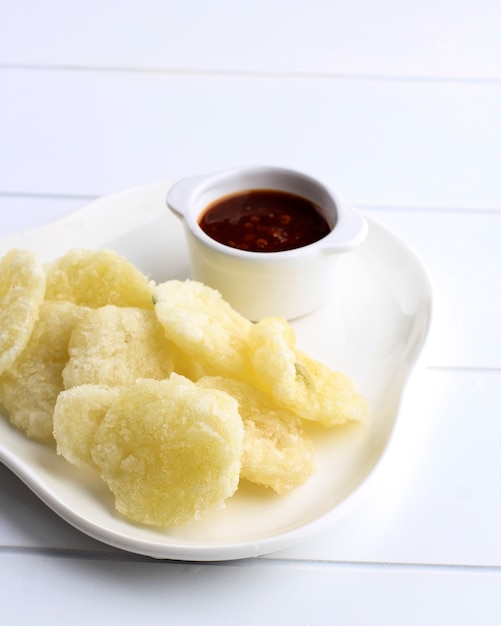 Rujak Cireng or Cireng Bumbu Rujak. Aci Digoreng (Cireng)  is a Traditional Street Food Snack from West Java, Made from Tapioca Flour, Water, and Choppes Green Onion. Served with Spicy Sauce.