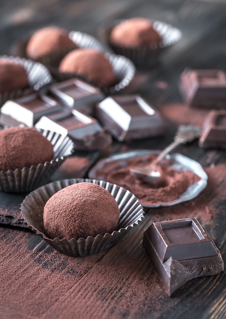 Rum balls with cocoa powder and chocolate slices