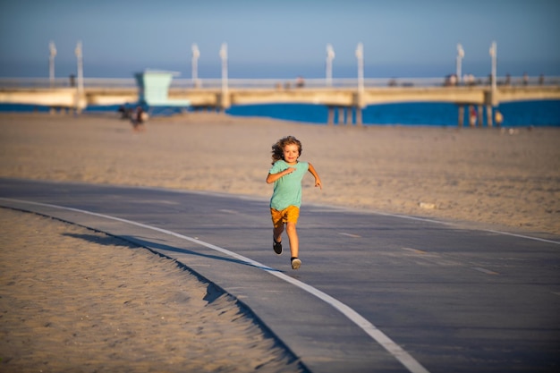 Run child outdoor. Sport boy have running.