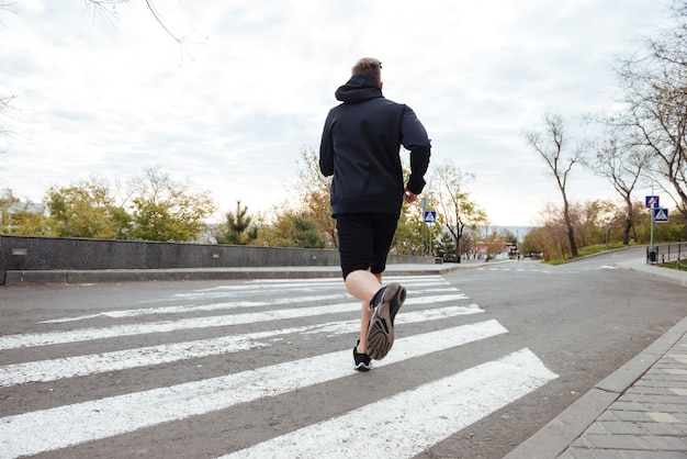 Runner on crosswalk back view