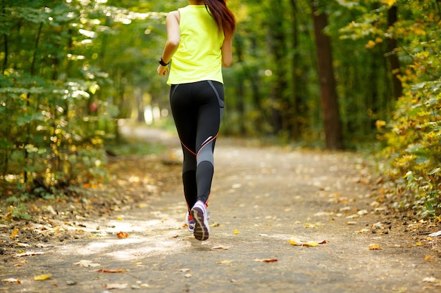 Runner feet running on road