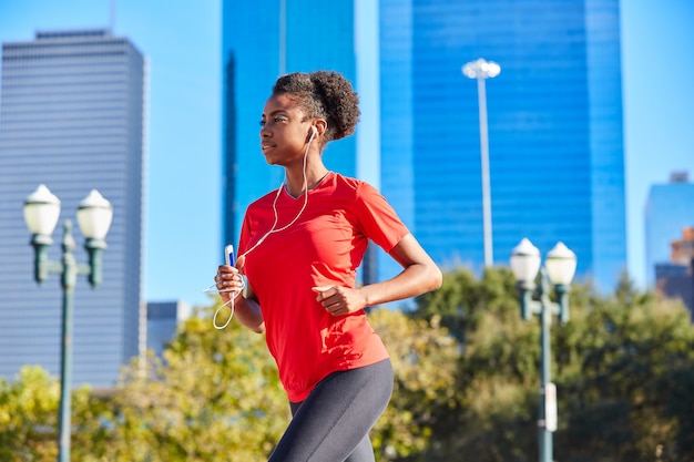 Runner girl running listening music earphones