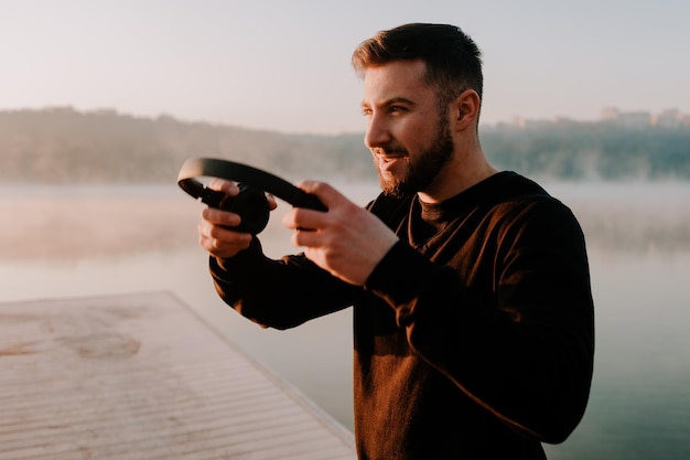 Runner listening to music and doing sports outside