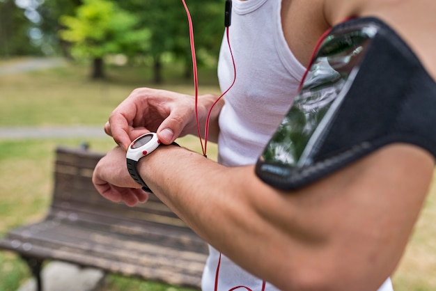 Runner in the park using smart watch