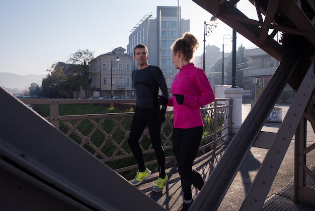 runner   woman warming up and stretching before morning jogging