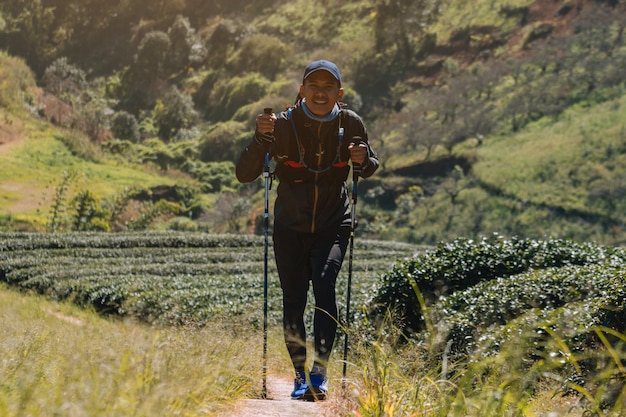 Photo runners. young people  trail running on a mountain path. adventure trail running on a mountainlifestyle.