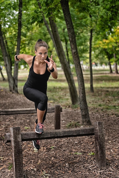 Running across wooden hurdles