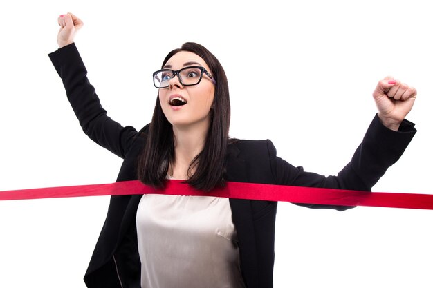 Running business woman crossing finish line isolated on white