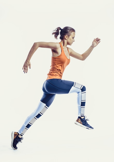 Running caucasian woman studio isolated on white