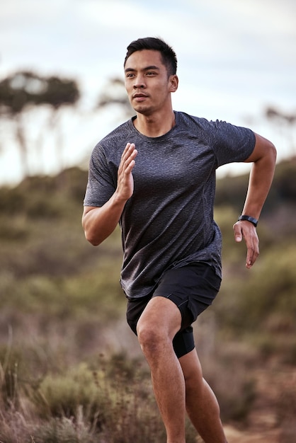 Running clears the mind of all worries Shot of a young man exercising in nature