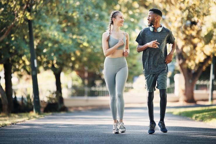 Photo running fitness and interracial couple in nature for cardio exercise and marathon training workout sports and young man and woman with motivation love and health as a runner in park with energy