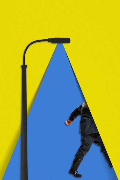 Running serviceman. The blue light of a paper lantern illuminates a walking person on yellow background. Dream, paperworld. Contemporary colorful and conceptual bright art collage with copyspace.