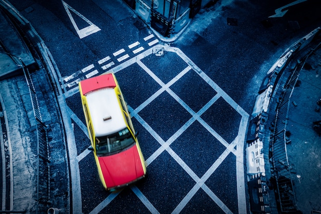 A running taxi, asphalt road, Hongkong