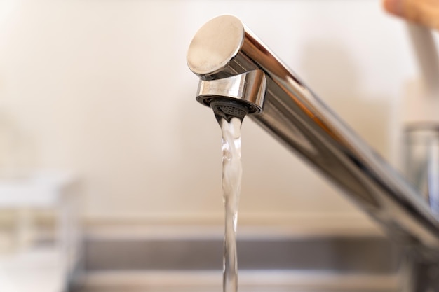 Running water from the faucet in the kitchen.