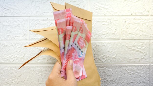Rupiah banknotes money in brown envelope Indonesian bills in envelope