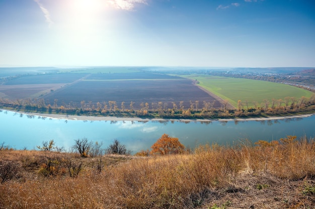 Rural autumn landscape View from the high bank of the river to the valley on the opposite bank River in the fall Beautiful nature