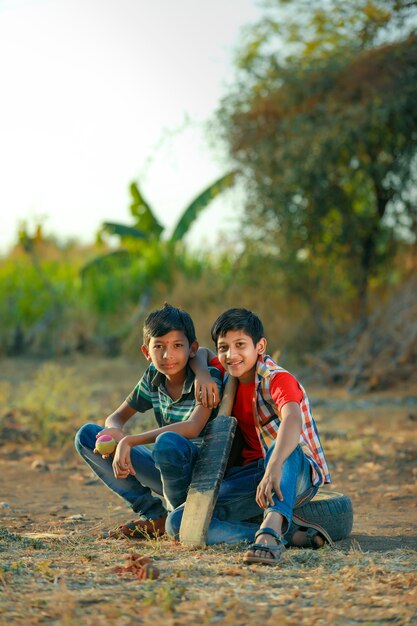 Rural Indian Child Playing Cricket